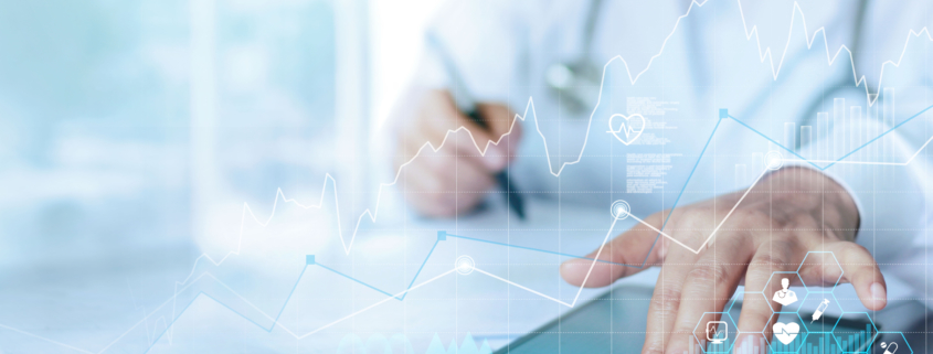 Doctor reviewing a medical report on a tablet, reflecting stronger clinical risk assurance