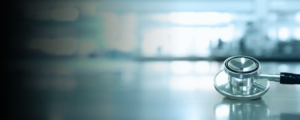 Stethoscope in a clinical setting, reflecting evidence-based improvements in workforce performance.